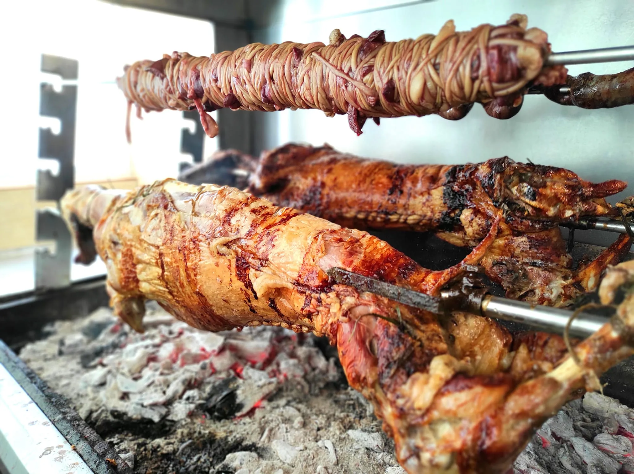 Charcoal spit roasting at Thanasis
